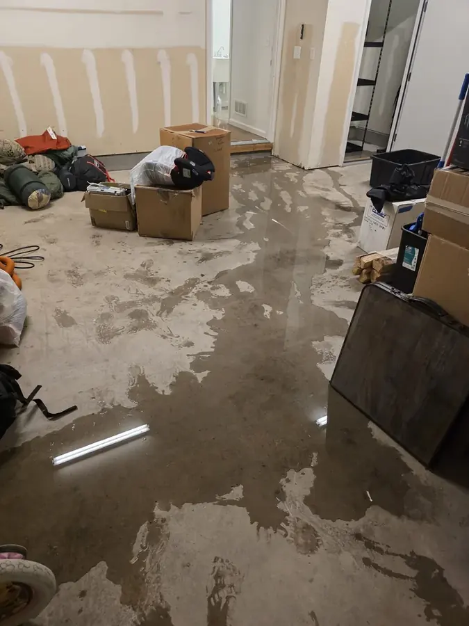 Flooded finished basement being cleaned up in a Peyton, CO home