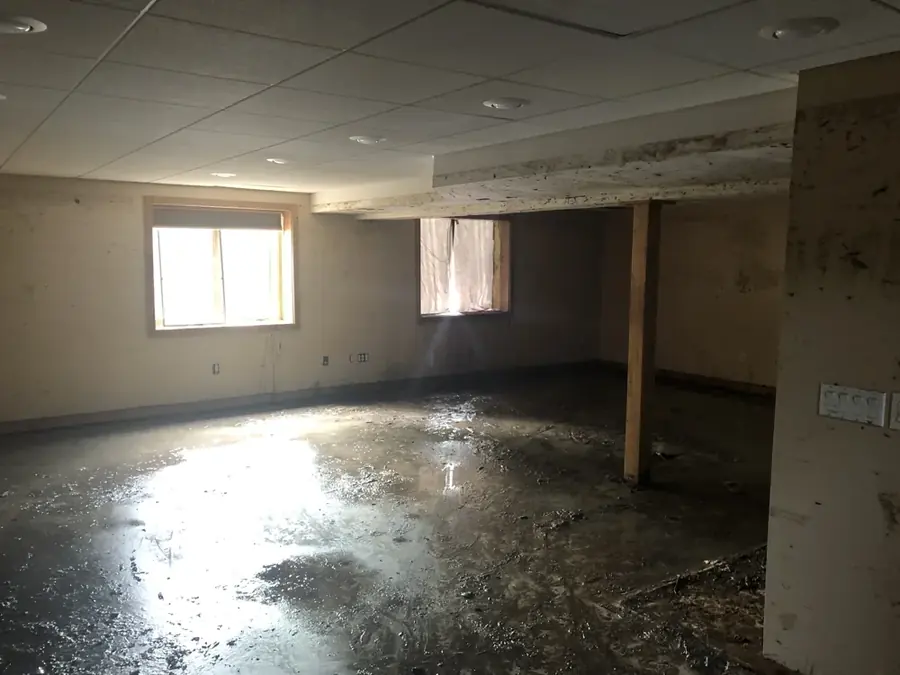 Failed sump pump and flooded basement pit in a Peyton, CO home